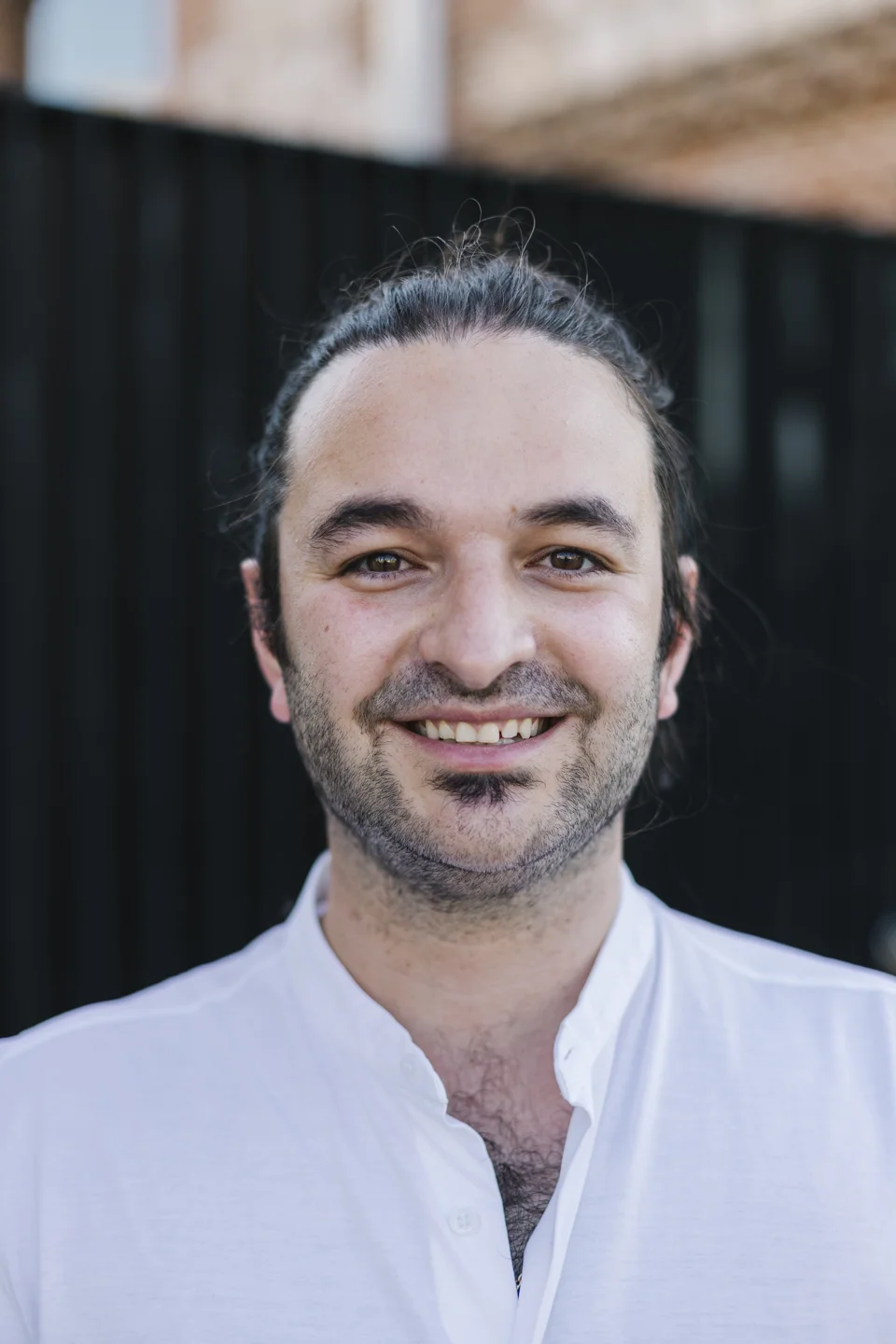 Davide Amato smiling outdoors
